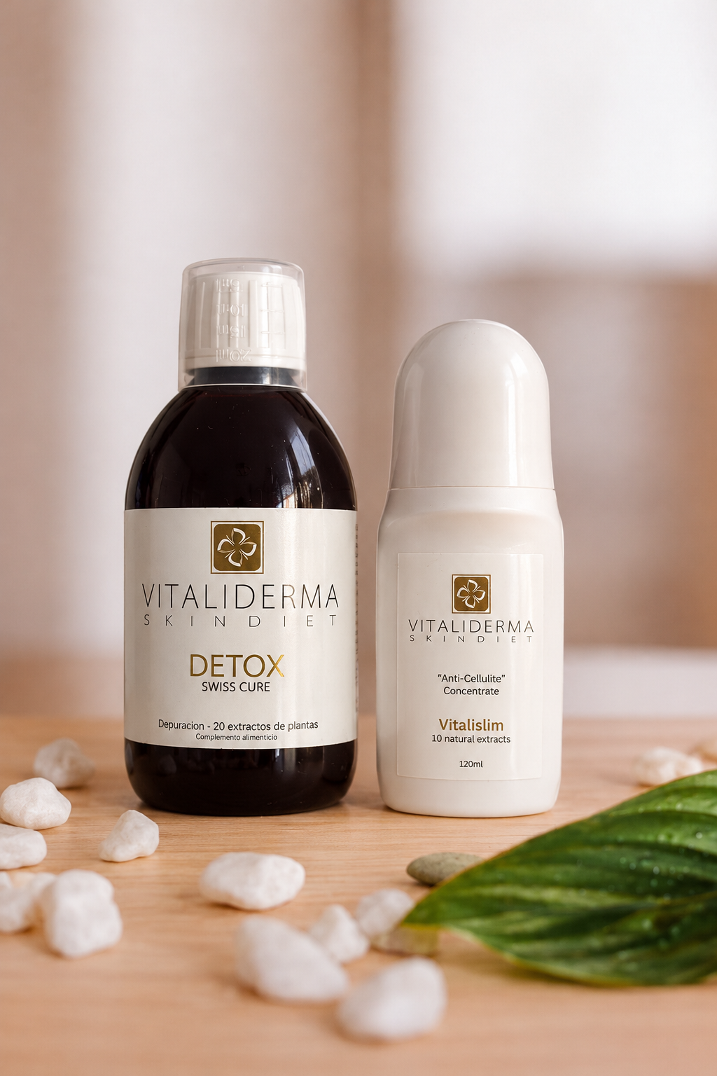 Detox Swiss Cure and Vitalislim Roll-On Anti-Cellulite with white pebbles and a leaf